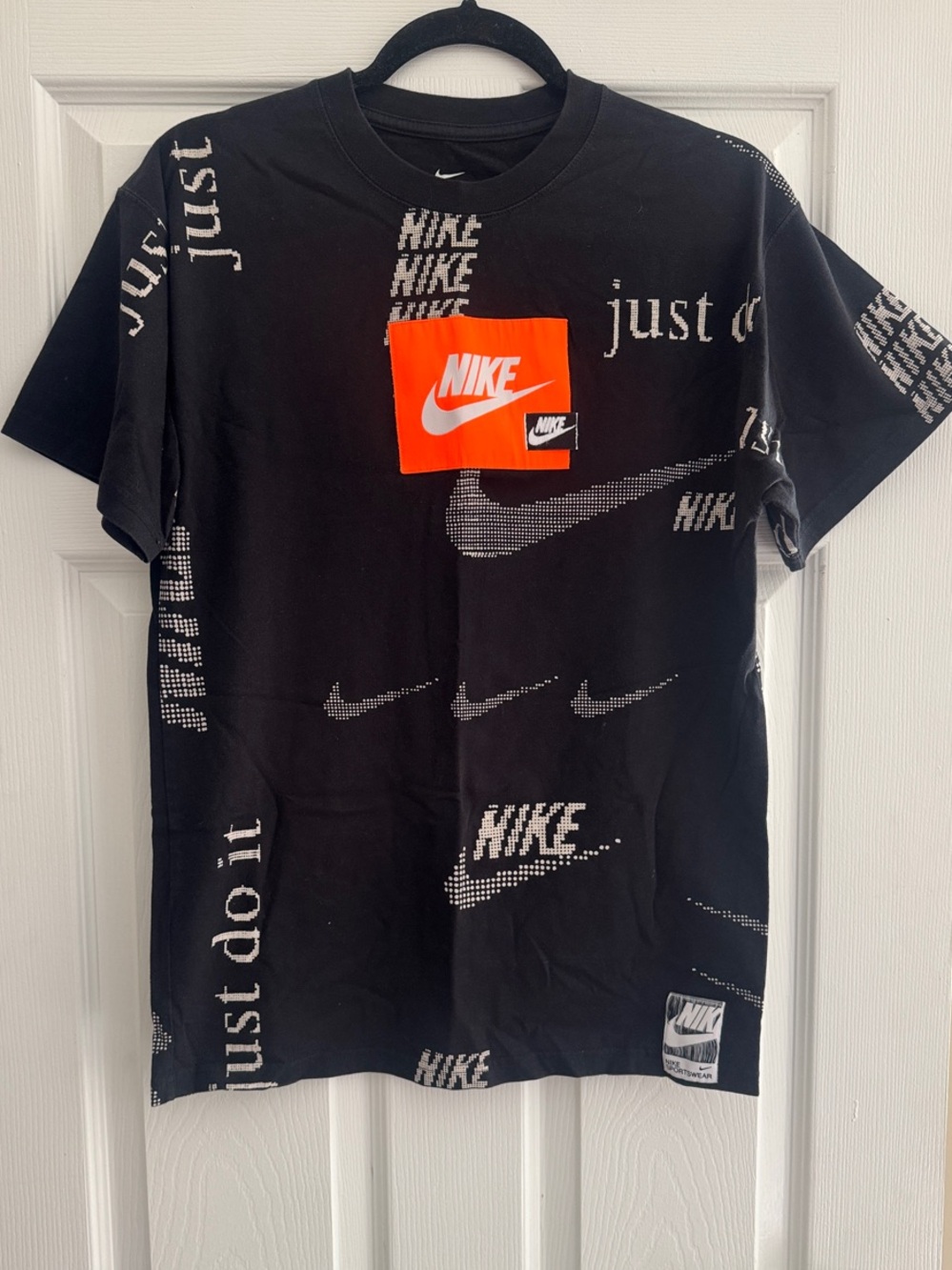 Nike Black Short-Sleeve Logo Patch Tee with Orange Accent